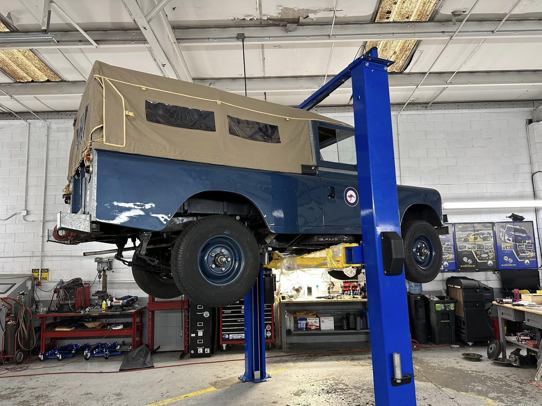 Vintage Land Rover on lift at Elk Mountain Motors